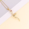 Macro detail of a 18K gold snake pendant with sparkling zircon inlay and red gemstone eyes - Red Eye Clear Zirconia Snake Style (6#)