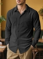Detailed texture of black corduroy shirt with dual breast pockets on male model - S / Tops / Black
