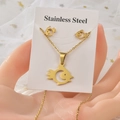 Golden stainless steel fish jewelry set including necklace and earrings displayed on white card - Gold Fish