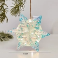 Fiocco di neve LED iridescente da 14 cm con luce calda appeso al ramo di pino - Stella Luminosa