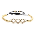 Modisches vergoldetes Perlenarmband mit drei Zirkonia-Smileys an schwarzer Kordel - Dreifache Pave Zirkonia Smileys / Goldene Kupferperlen Mit Schwarzem Seil