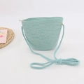 Detail of light blue straw woven crossbody bag with zipper and woven texture for kids - Blue