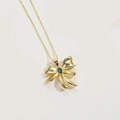 Collier avec pendentif nœud doré et zircon vert sur fond blanc minimaliste - Noeud Zircon Ovale Vert Or