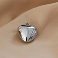 Macro shot of silver heart pendant with polished mirror finish and top hanging ring - 15# White K Heart 15