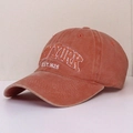 Detail of New York embroidery on washed orange cotton baseball cap with vintage finish - One Size / Orange