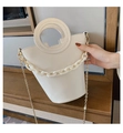 Detail of cream white bucket bag with round handle and chunky chain decoration - White