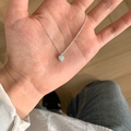 Elegant silver necklace featuring a heart-shaped opal pendant held in hand for scale - Heart-shaped Opal Effect Pendant Necklace (XL3187)