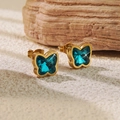 Macro shot of 18K gold plated stainless steel butterfly earrings with blue zircon - Lake Blue Butterfly Stud Earrings (BD510-blue)