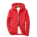Red hooded windbreaker jacket with full zipper and elastic cuffs on a wooden hanger - S / Red
