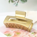 Rectangular hollow metal hair claw clip in elegant gold finish for women - Metallic Gold