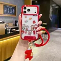 Detail of red iPhone case with festive motifs, red braided lanyard, and horse charm - Pp Spring Festival * Red Five Blessings Pony + Handbag / iPhone15