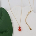 Golden necklace with double-beaded red agate gourd pendant on a white shell plate - Red Agate