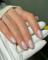 Macro shot of glossy milky white almond press-on nails with sleek polished finish - Creamy White Glossy (CW446)