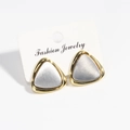 Minimalist triangular stud earrings with gold frame and brushed silver finish on card - Silver