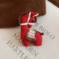 Detail of red fabric horse brooch with white stitching on a canvas book cover - 23# Brooch - Red - Pony