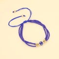Böhmisches Evil Eye Perlenarmband mit blauen Perlen und goldenen Akzenten - Königsblau