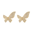 Macro detail of 18K gold plated bow earrings with sparkling clear zircon inlay - Exquisite Micro-pave Butterfly