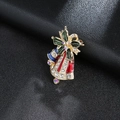 Detail of Christmas bell brooch with colorful enamel and sparkling rhinestones on leather - Gold Christmas Bell