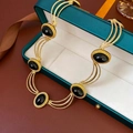 Vintage style golden necklace featuring six oval black onyx gemstones in a layered chain - Necklace-Black