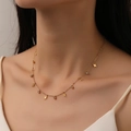 Gold titanium steel necklace featuring dangling lightning bolts and sparkling zircon charms - Lightning (L211)