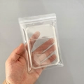 Transparent PVC resealable storage bag for jewelry shown in a person's hand - 50 Micron 7.6x11.5cm Resealable / 100 Pcs/Pack