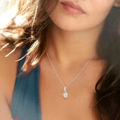 Silver infinity heart pendant necklace with round zircon stone worn by a model - Wishbone White Gold Color (762)
