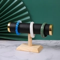 Solid wood T-bar jewelry display stand with black leather cylinder and gold metal caps - Type B Black Leather