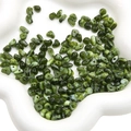 Irregular green acrylic beads in a white dish for DIY jewelry and bracelets - Olive Green