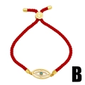 Verstellbares rotes geflochtenes Evil Eye Armband mit Goldakzenten und blauem Zirkonia - Rot