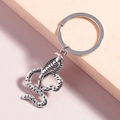 Portachiavi cobra vintage in lega di zinco argentata con trama a pelle di serpente - Cobra d'Argento