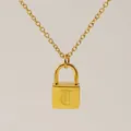 Minimalist gold necklace featuring a polished rectangular padlock pendant with letter T - Letter T Style
