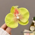 Elegant white mesh orchid hair clip with green-pink gradient petals and center pearl - Yellow Orchid