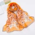 Soft orange georgette silk scarf with white lily floral print and brown border - Orange