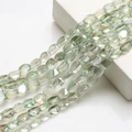 Macro shot of oval iridescent green crystal twist beads for DIY jewelry making - Spring Green
