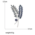 Silver leaf brooch with deep blue rhinestones, measures 5.7cm by 3.1cm and weighs 9.5g - Blue