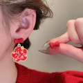 Detail of red earrings with pearl studs featuring Good Luck and Wealth Chinese script - Silver Earring Post - Red - Luck