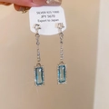 Detailed shot of long silver 925 tassel earrings with blue rectangular zircon gemstones - 23# Silver Rectangular Blue Zircon Drop Earrings with Silver Earring Post