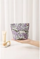 Gros plan d'une trousse à maquillage en toile fleurie violette avec zip décoratif - Taro Floral Tissé-Teint Petit