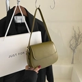 Olive green leather saddle bag with adjustable shoulder strap and gold hardware - Green