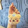 Plush brown bear head keychain with lamb wool texture and embroidered party hat - Light Coffee