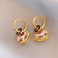 Close-up of 18k gold plated hoop earrings with white enamel horse charms on silk fabric - 11# Ear Buckle-Gold-Pink-White Enamel Pearl Horse Earrings-Gold Plated