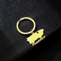 Detailed close-up of golden Puerto Rico map keychain with heart cutout on black surface - Gold E