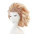 Champagne gold satin sleep cap with pink bow headband on mannequin head profile - Medium Single Layer Cross Ribbon / Khaki