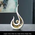 Modern abstract ceramic phoenix sculpture in matte white and electroplated gold finish - White Gold Phoenix (Tall)