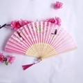 Pink silk folding fan with bamboo frame featuring cherry blossoms and tower pattern - Pink Cherry Blossom Pagoda Style (Women's Fan - 22)