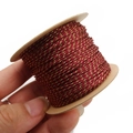 Macro shot of 1mm burgundy and gold metallic braided thread on a cardboard spool - Approx. 1.0mm 40m / Burgundy