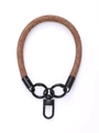 Detail of brown woven phone wrist strap featuring black metal carabiner and D-ring - Bitter Chocolate