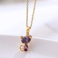Collar de acero de titanio dorado con colgante de gato de cristal púrpura y diamantes - Collar de Colibrí con Cadena / Dorado/Púrpura