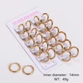 Detail view of 12 pairs of golden 14mm stainless steel hoop earrings on a display card - 2.5mm Wire 14mm Inner Diameter / Gold