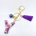 Letter Y resin keychain with purple glitter, matching tassel and golden metal hardware - Letter Y